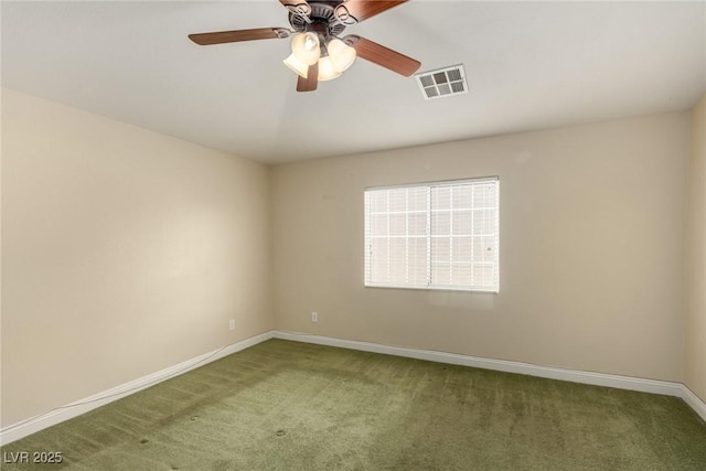 carpeted spare room with ceiling fan