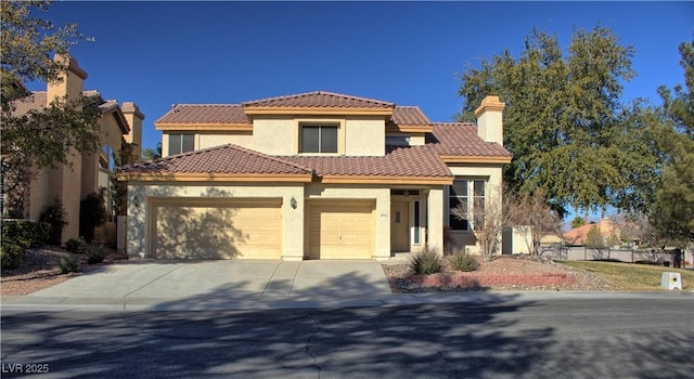 mediterranean / spanish-style house featuring a garage