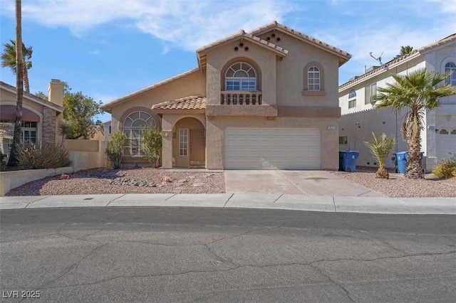 mediterranean / spanish-style house featuring a garage