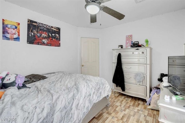 bedroom with ceiling fan and light hardwood / wood-style floors