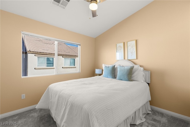 bedroom featuring ceiling fan, lofted ceiling, and dark colored carpet