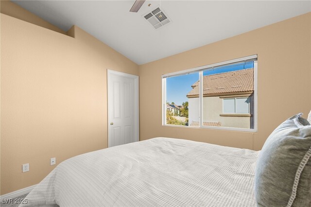 bedroom with ceiling fan and vaulted ceiling