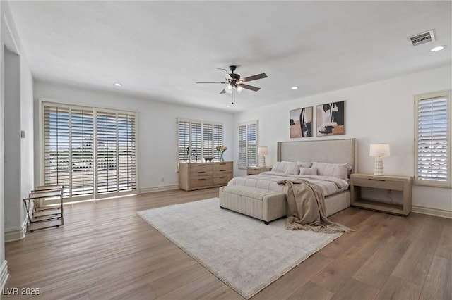 bedroom with ceiling fan and light wood-type flooring