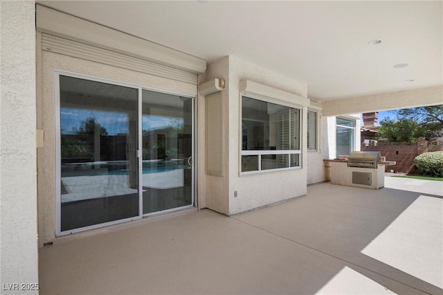 view of patio with a grill and area for grilling