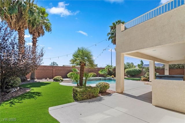 view of patio / terrace with a fenced in pool