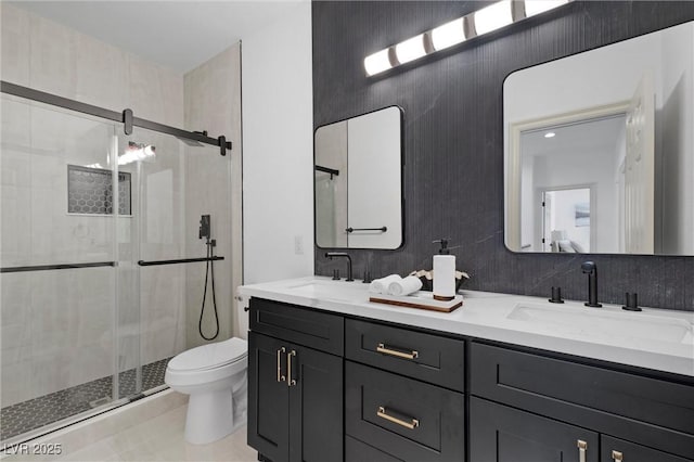 bathroom featuring an enclosed shower, vanity, tile patterned flooring, and toilet