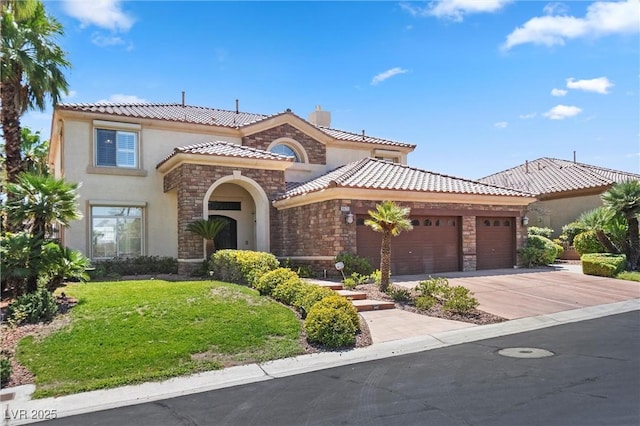 mediterranean / spanish-style house featuring a front lawn and a garage