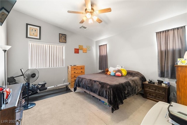 carpeted bedroom featuring ceiling fan and lofted ceiling