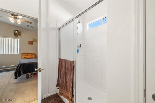 bathroom with lofted ceiling, a shower with shower door, and ceiling fan