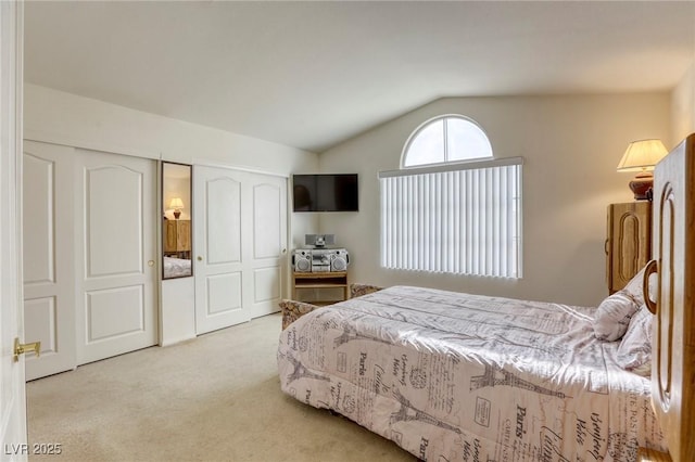 bedroom featuring carpet and lofted ceiling