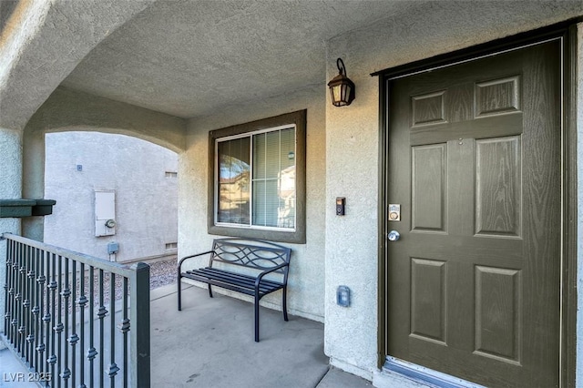 entrance to property featuring a balcony