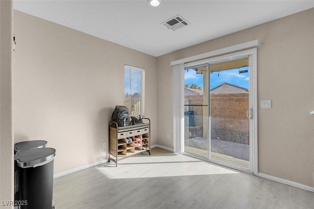 entryway with light hardwood / wood-style flooring