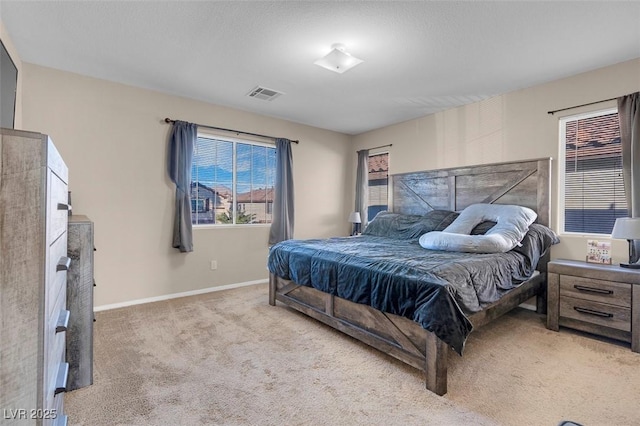 bedroom featuring light colored carpet