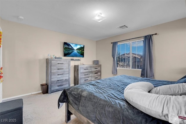 bedroom with light colored carpet