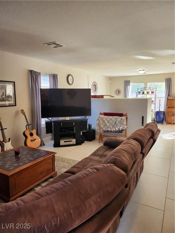 living room with light tile patterned floors