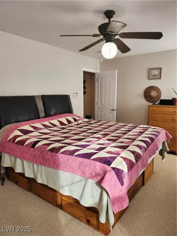 carpeted bedroom with ceiling fan