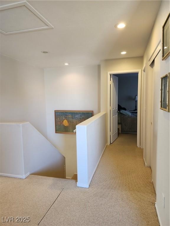 hallway with light carpet