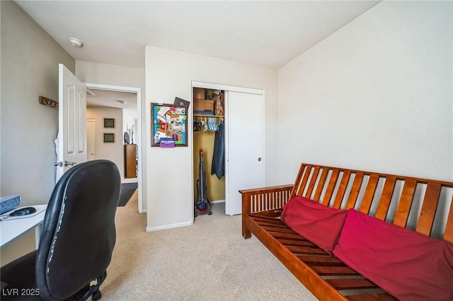 bedroom with light colored carpet and a closet