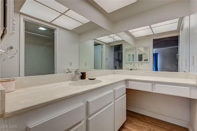 bathroom featuring vanity and hardwood / wood-style floors