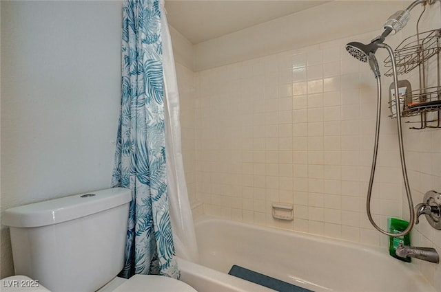 bathroom featuring toilet and shower / tub combo