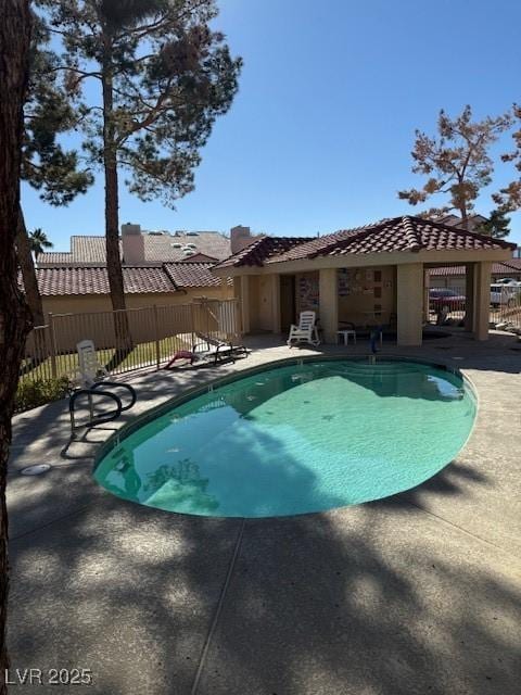 view of swimming pool with a patio