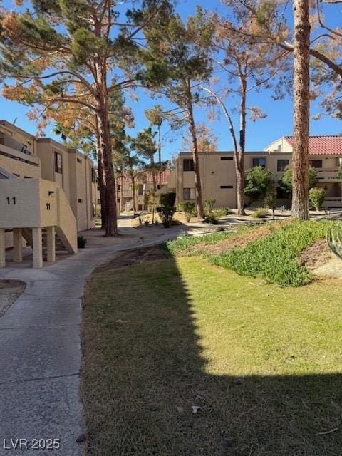 view of home's community featuring a yard