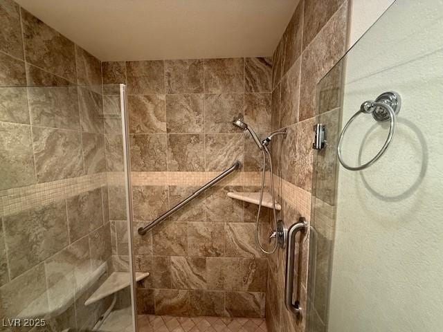 bathroom with a shower with shower door