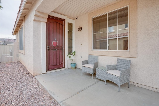 entrance to property with a patio area