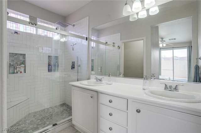 bathroom with an enclosed shower, vanity, plenty of natural light, and ceiling fan