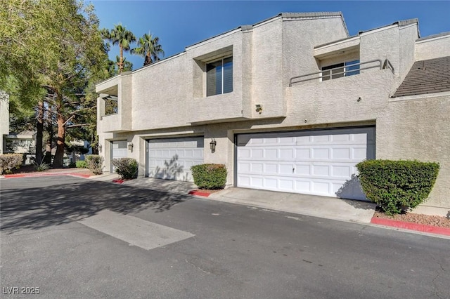 multi unit property featuring a garage