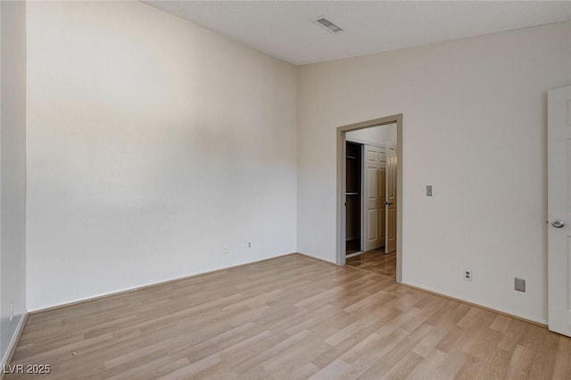 empty room with light hardwood / wood-style floors