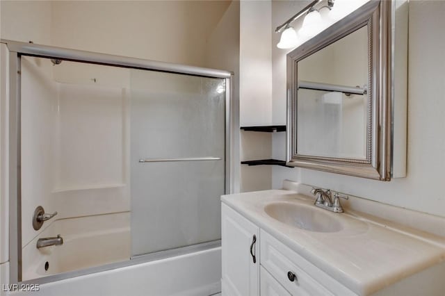 bathroom with vanity and shower / bath combination with glass door