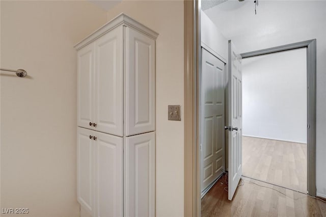 hallway with light wood-type flooring