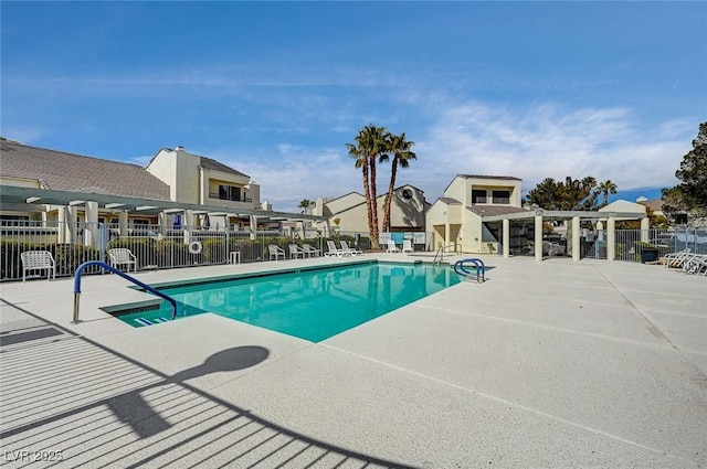 view of swimming pool with a patio