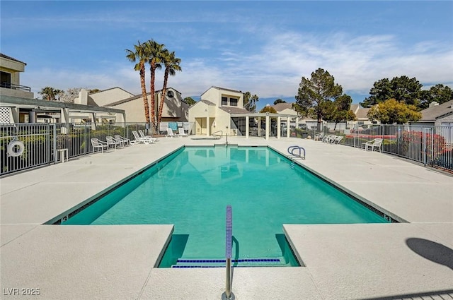 view of swimming pool featuring a patio area