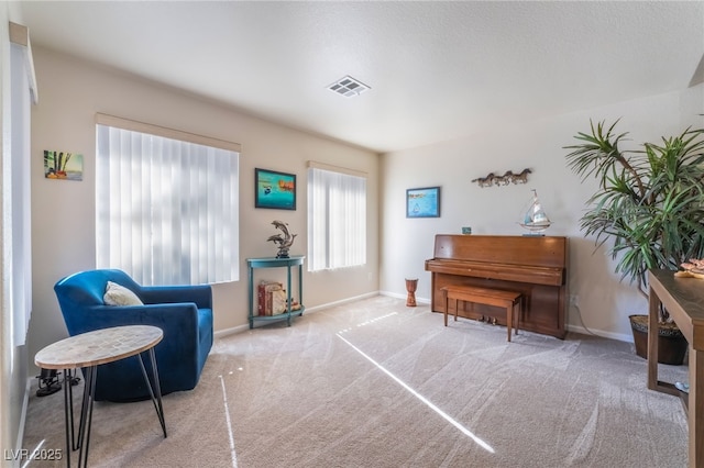 living area with light carpet