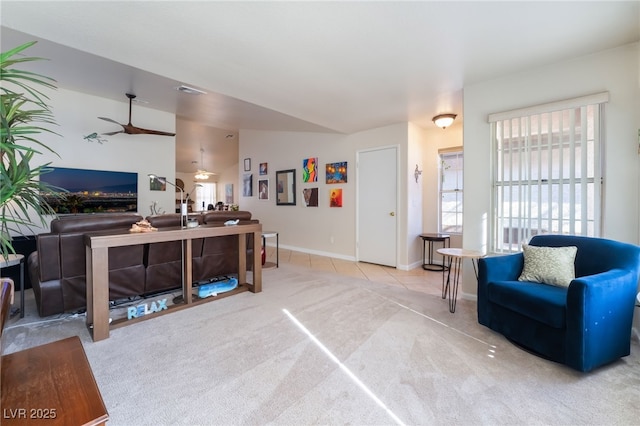 living room with ceiling fan and light colored carpet