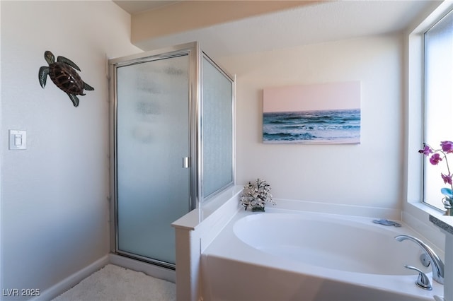 bathroom with shower with separate bathtub