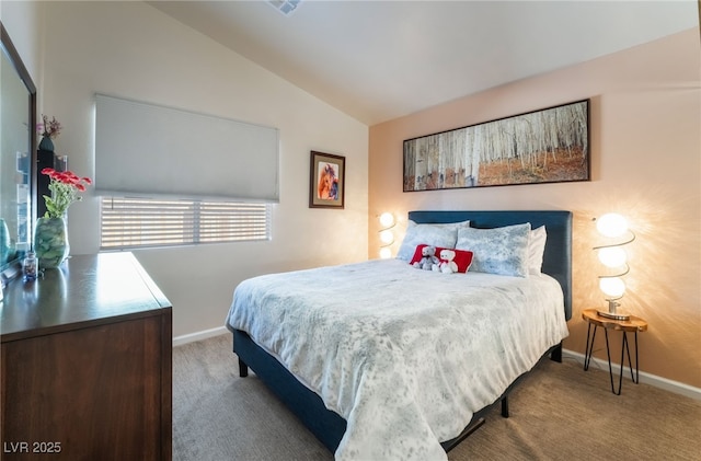 carpeted bedroom with vaulted ceiling