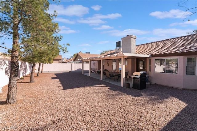 rear view of house with a patio area