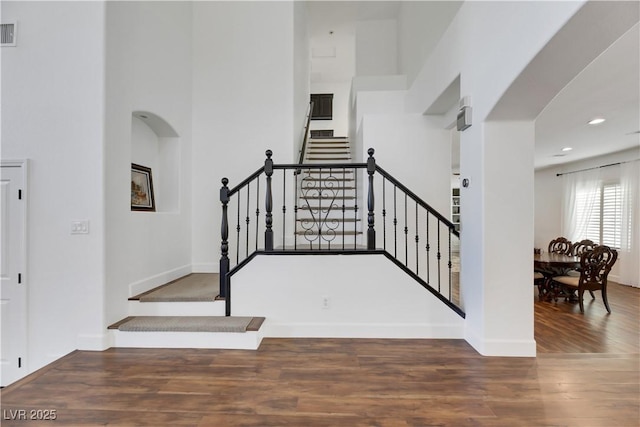 stairway featuring hardwood / wood-style floors