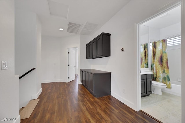 hall with dark hardwood / wood-style flooring