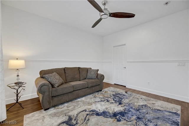 living room with ceiling fan and dark hardwood / wood-style floors