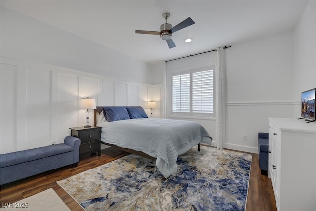 bedroom featuring ceiling fan and dark hardwood / wood-style flooring