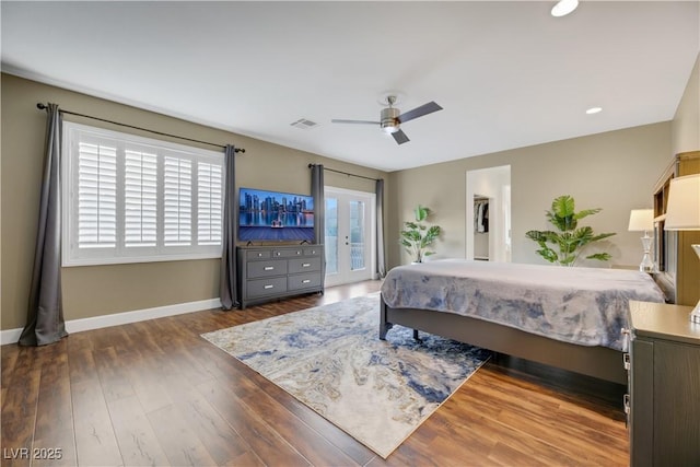 bedroom featuring ceiling fan, access to exterior, and dark hardwood / wood-style flooring