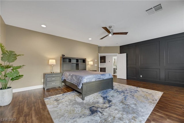 bedroom featuring ceiling fan and dark hardwood / wood-style floors