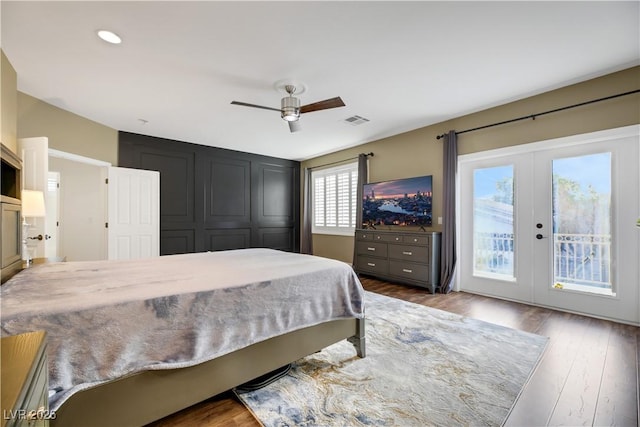 bedroom with hardwood / wood-style flooring, ceiling fan, french doors, and access to outside