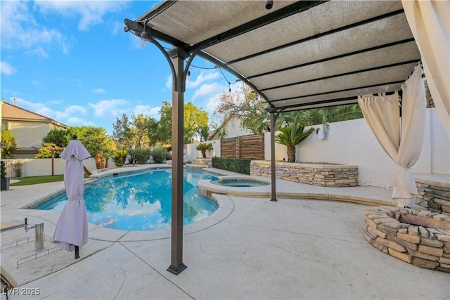 view of pool with a patio and an in ground hot tub