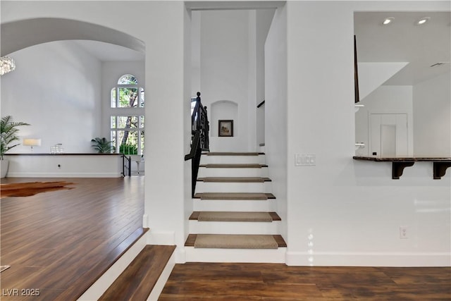 stairway featuring hardwood / wood-style flooring