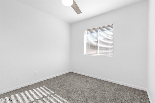 spare room with carpet floors and ceiling fan